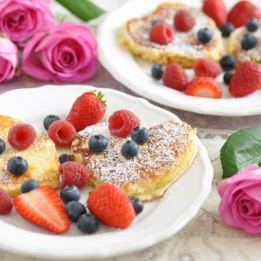 Special brunch pancakes with fruit on white plates