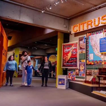 Oakland Museum of California history gallery with family