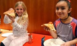 Kids at museum with pizza
