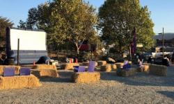 Outdoor movie screen and straw bale seating