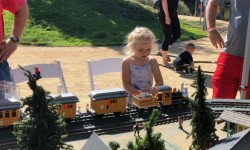 Child with garden scale train