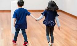 Kids at museum holding hands