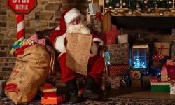 Santa next to fireplace