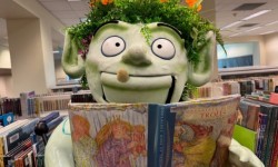 Wylding Woods monster puppet with book