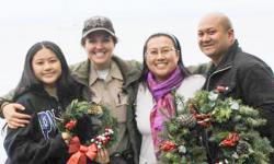family and ranger with wreaths