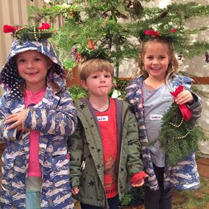 Children Holding Holiday Nature Crafts 