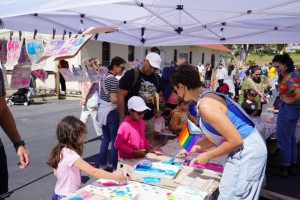 Pride craft table with kids at Bay Area Discovery Museum