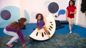 Wobbleland kids playing on giant fruit Bay Area Discovery Museum