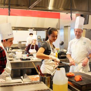 teenagers cooking in the Hestan Kitchen