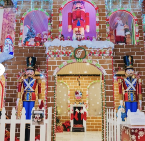 Life-sized holiday gingerbread house decorated for Christmas at Fairmont San Francisco.