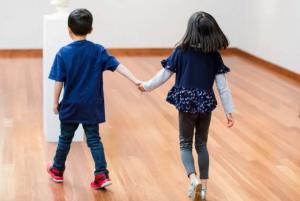 Kids at museum holding hands