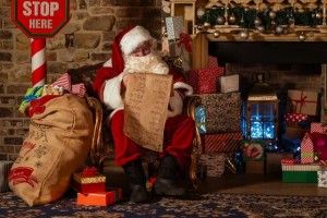 Santa next to fireplace