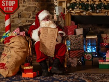 Santa next to fireplace