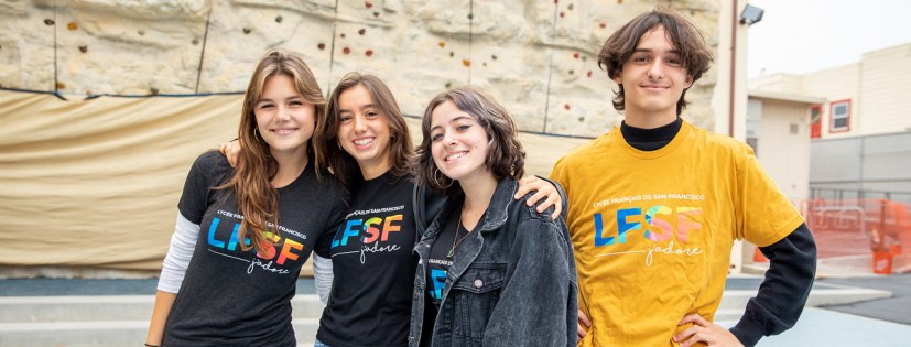 HS students by climbing wall