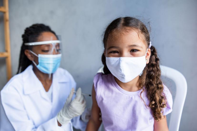 Girl getting COVID vaccine shot