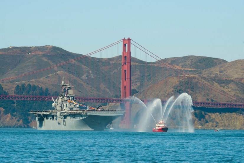 Fleet week ship and fire boat in front of Golden Gate Bridge