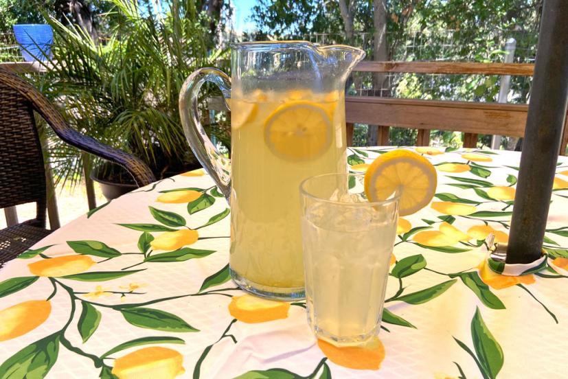 Lemonade in pitcher with glass of lemonade