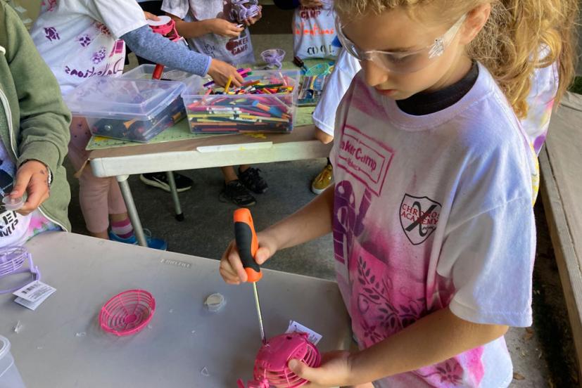 Girl building something at maker camp
