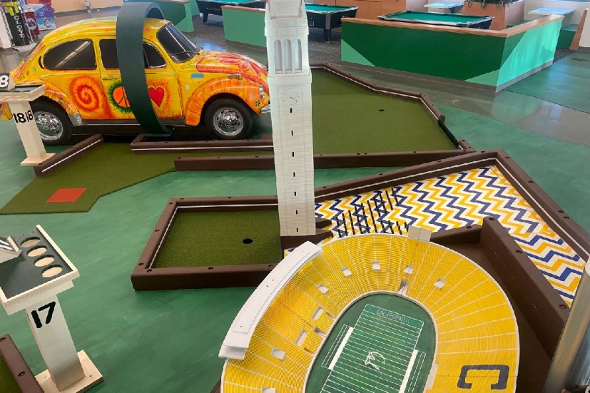 Subpar mini golf hole with Campanile and Memorial Stadium models