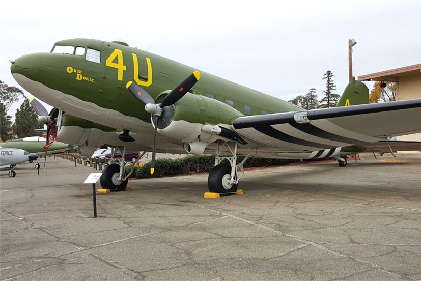 Douglas C-47 aircraft in WWII olive green paint and invasion stripes