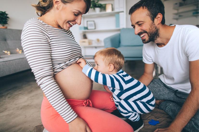 Pregnant mom, dad, and toddler
