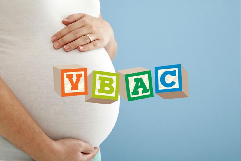Pregnant woman's belly with VBAC spelled out in blocks