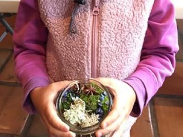 Child with moss garden