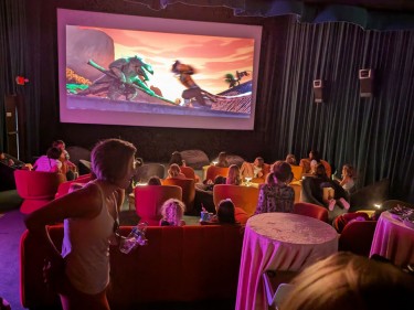 Interior of Cinelounge Tiburon movie theater during kids' cartoon screening