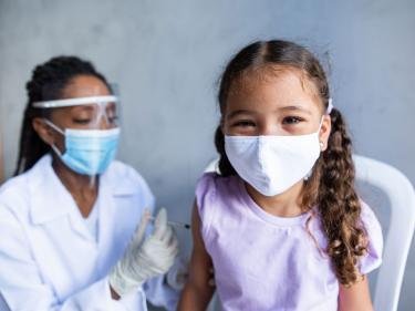 Girl getting COVID vaccine shot