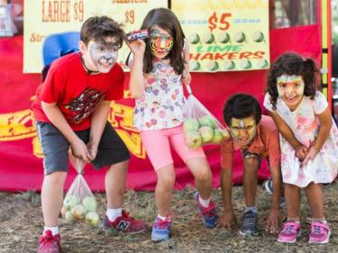 Kids playing at the Gravenstein Apple Fair in Sebastopol