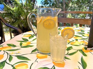 Lemonade in pitcher with glass of lemonade