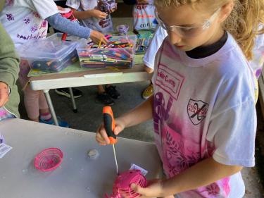 Girl building something at maker camp