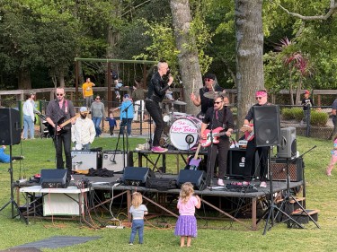 Marinwood Music in the Park band with dancing kids