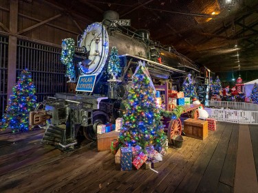 Steam locomotive with Christmas Trees and Polar Express sign at California State Railroad Museum