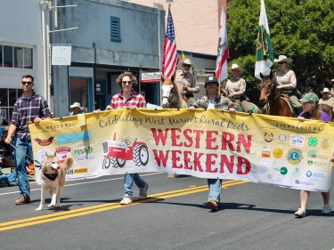 Marchers with banner at Western Weekend Parade in Point Reyes Station